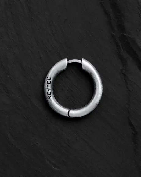 Srebrny kolczyk koło ORBIT
